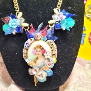 Wendy Gell Necklace Lady in a Garden with Jewels and leaves.